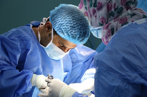 Doctor performing surgery in operating room